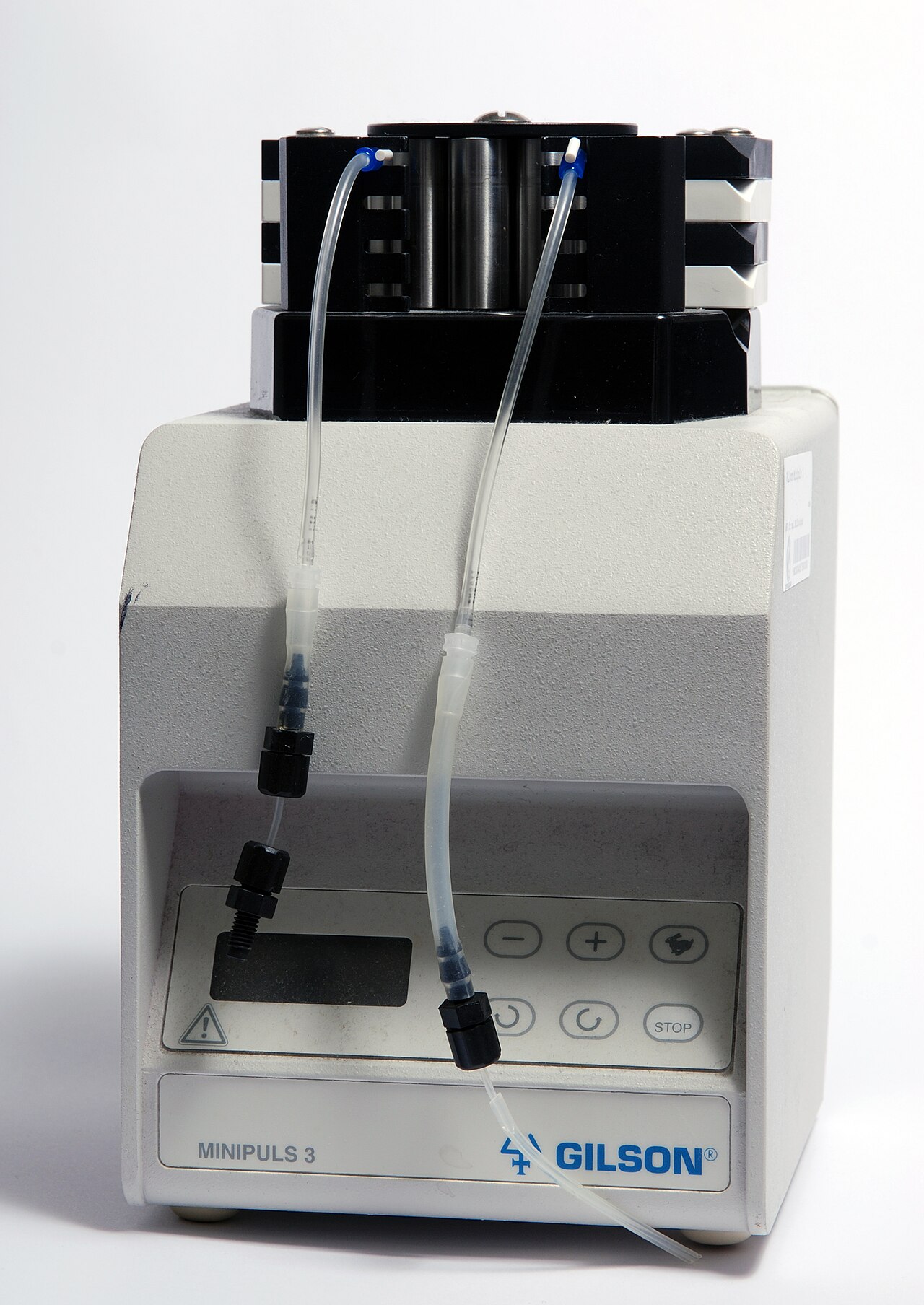 Laboratory peristaltic pump with multiple rollers and flexible tubing